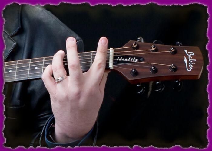 joey-stuckey hand on guitar neck