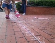 kids enjoying side walk chalk at Alive Day