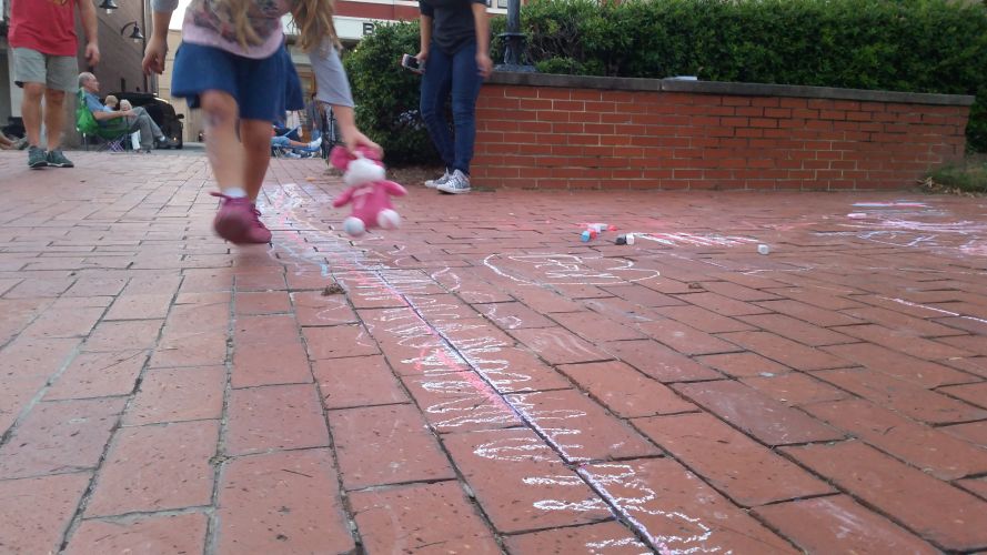 kids enjoying side walk chalk at Alive Day