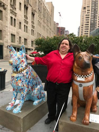 Joey with the K9 Cop statues on the Magnificent Mile in Chicago